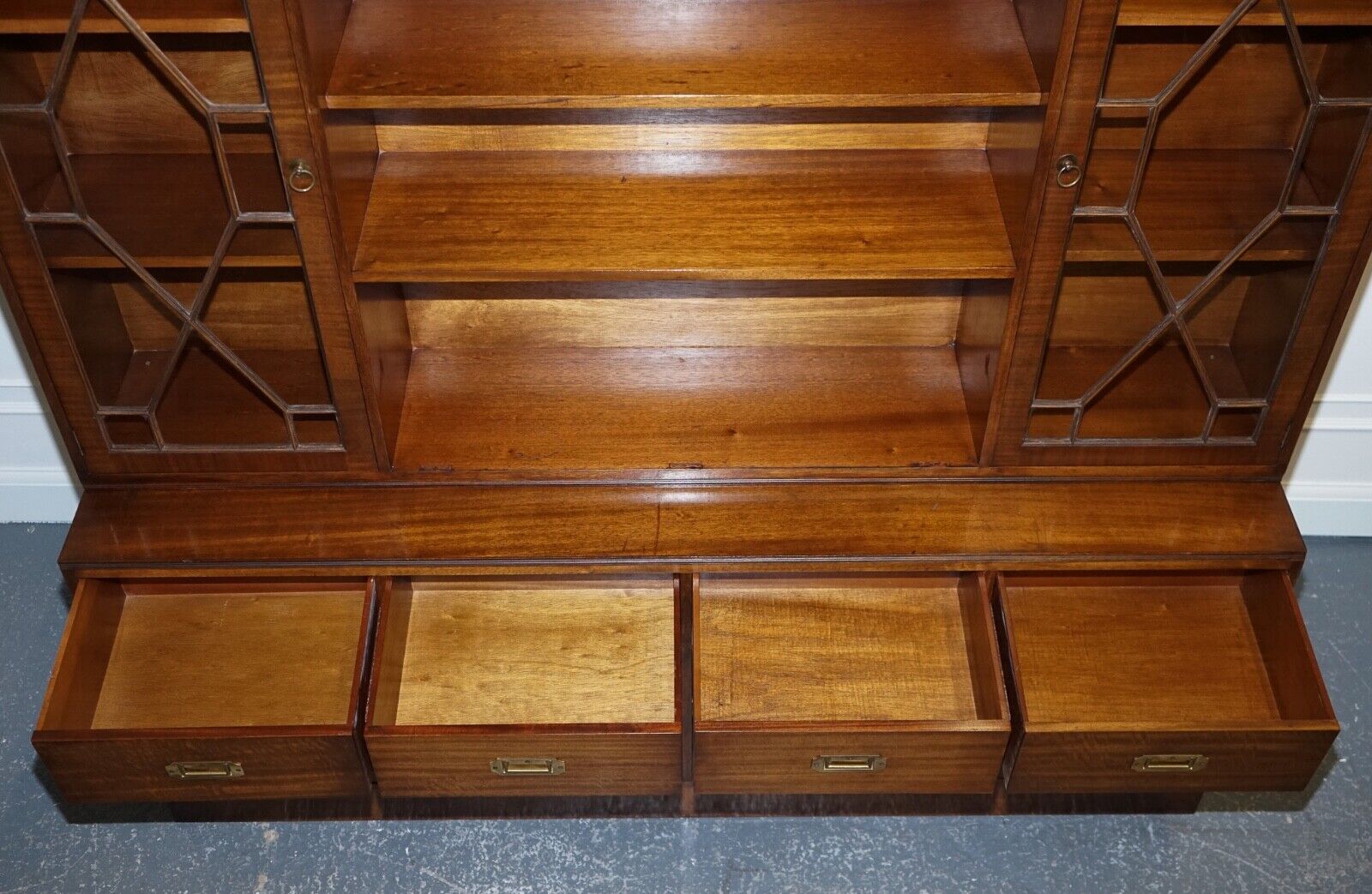 VINTAGE BEVAN FUNNELL MILITARY CAMPAIGN BOOKCASE WITH EMBOSSED LEATHER DOORS