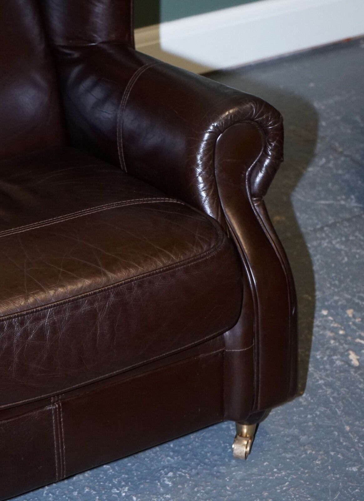 VINTAGE PAIR OF CHOCOLATE BROWN LEATHER WINGBACK CHAIRS