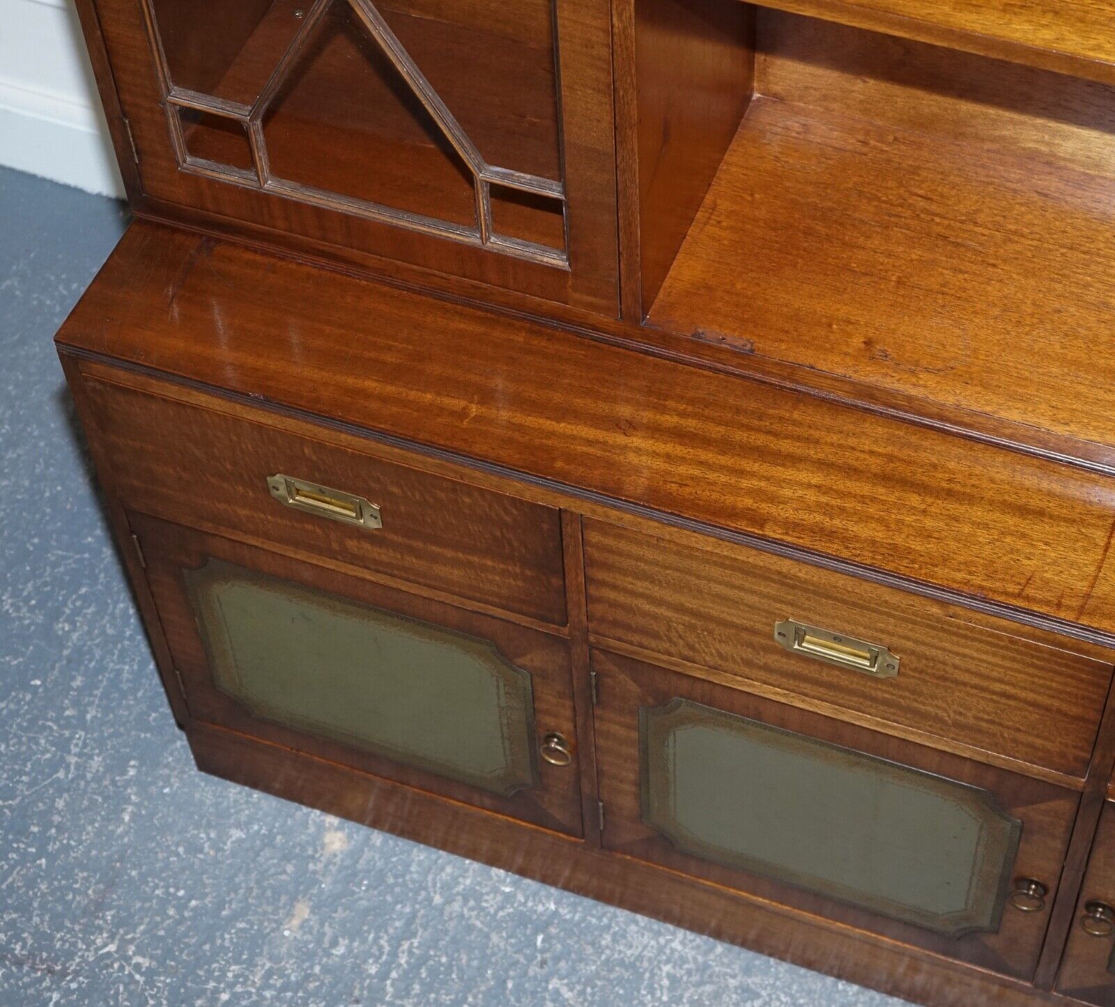 VINTAGE BEVAN FUNNELL MILITARY CAMPAIGN BOOKCASE WITH EMBOSSED LEATHER DOORS