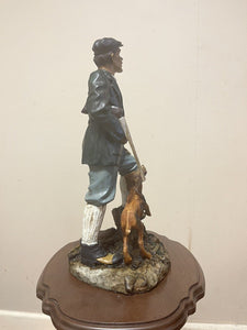 COLLECTORS COUNTRY MAN WITH DOG FIGURINE